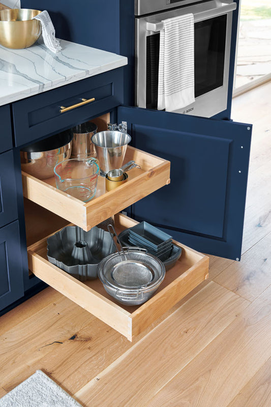 Blue shaker cabinets with pull out shelves