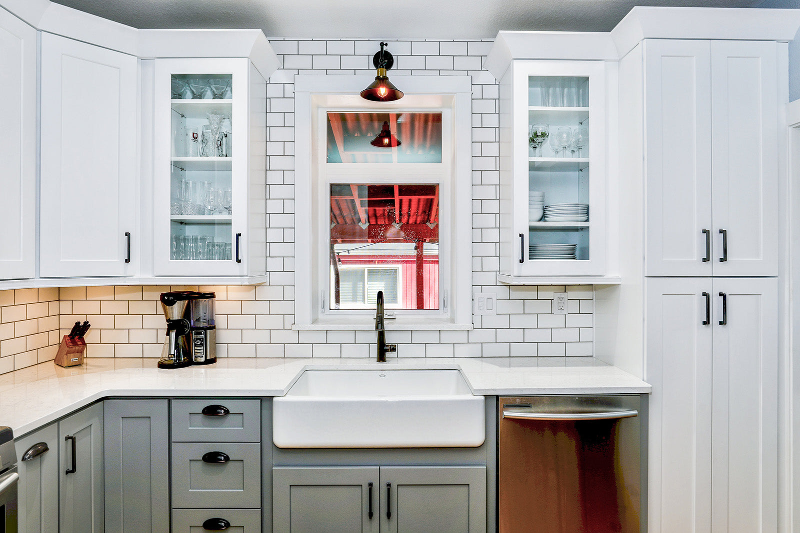 White and gray kitchen with window